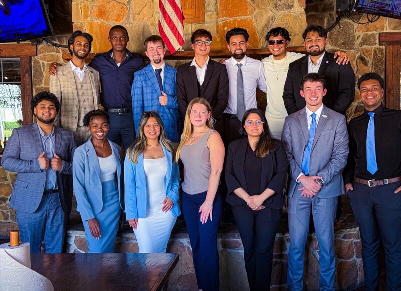 The full Relentless Marketing team in business dress at a company dinner